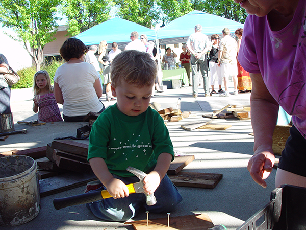Child participating in sculpture event